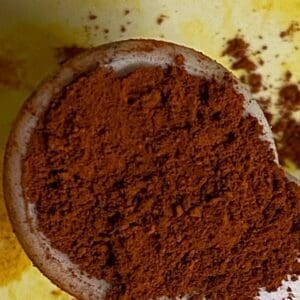 A bowl of ground coffee on top of a table.