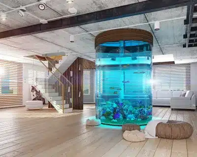 A large aquarium in the middle of a room.